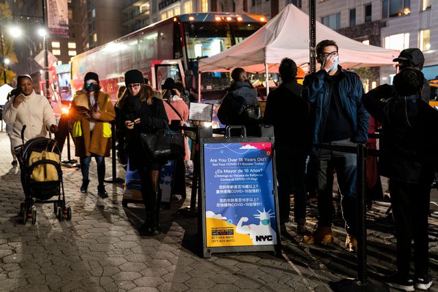 People wait to receive COVID-19 vaccine booster shots at a mobile station on 59th Street near Central Park, December 2nd, 2021